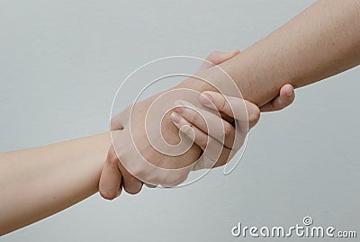 Helping Hands ,hand in hand relationship Stock Photo