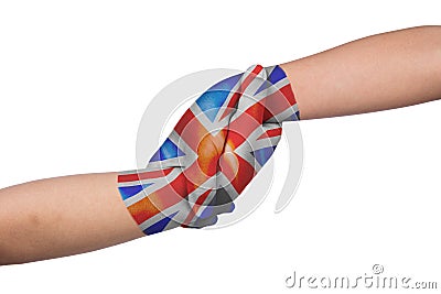 Helping hands of two children with United Kingdom flag painted Stock Photo