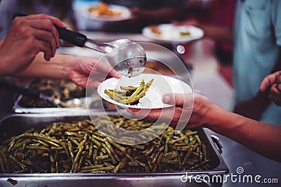 Helping the poor with free food to alleviate hunger, the concept of hunger and lack of food Stock Photo