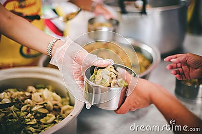 Helping the poor with free food to alleviate hunger, the concept of hunger and lack of food Stock Photo