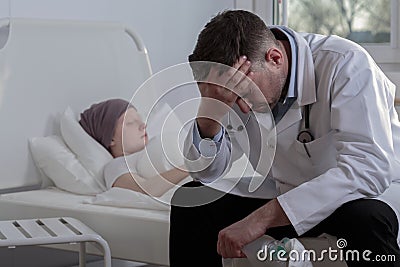 Helpless doctor and cancer child Stock Photo