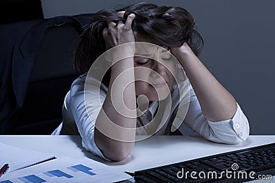 Helpless woman during overtime Stock Photo