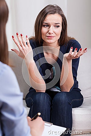 Helpless woman at therapy Stock Photo