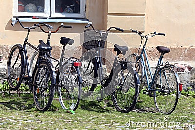 Helsinki, Finland. Bikes on the parking near house Editorial Stock Photo