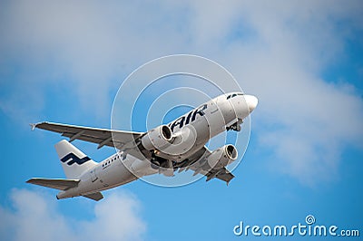 An Airbus A319, operated by Finnair, taking off from Helsinki-Vantaa airport. Editorial Stock Photo