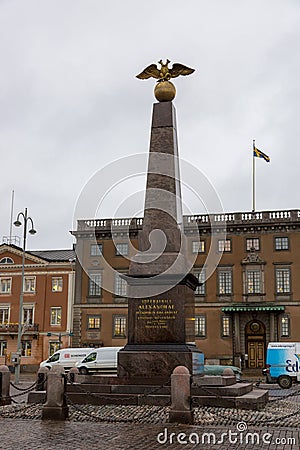Obelisk in memory of the Russian Empress Alexandra Fedorovna on the Market Square of Editorial Stock Photo