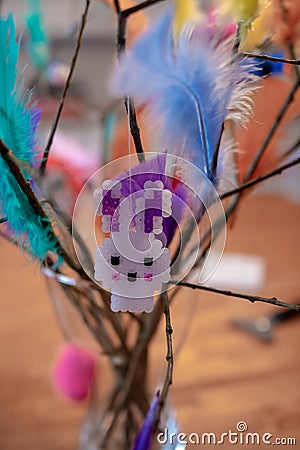 Helsinki, Finland - March 25, 2018: Easter bunny on Easter twig with colorful feathers Stock Photo