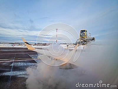 Ground deicing of aircraft Editorial Stock Photo