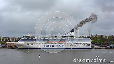 Black exhaust fumes coming from the chimney of an moored cargo-passenger cruise ferry ship Silja Serenade by Tallink after main Editorial Stock Photo