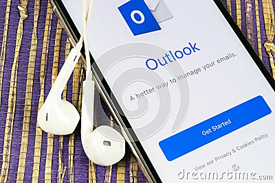 Microsoft Outlook office application icon on Apple iPhone X screen close-up. Microsoft outlook app icon. Microsoft OutLook applica Editorial Stock Photo