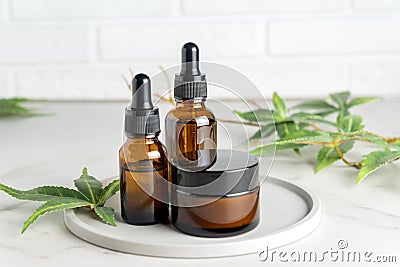 Hemp cbd oil serum in glass dropper bottles with cannabis leaves, Moisturizing cream, Cannabis leaf with skincare Stock Photo