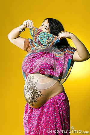 Henna tatoo on pregant belly Stock Photo