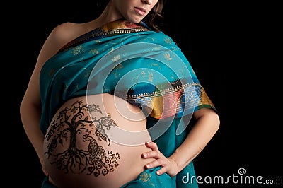 Henna tree of life pregnant belly Stock Photo