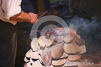 Blacksmith historical reenactor at Henricus,Virginia-the first colonial town in the USA. Stock Photo