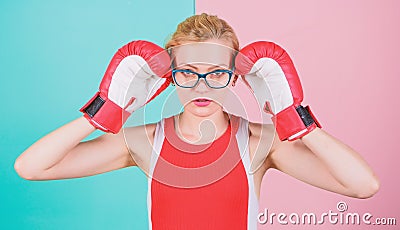 Her confidence is sexy. Cute boxer girl. Pretty woman in glasses and boxing gloves. Athletic woman in sports wear Stock Photo