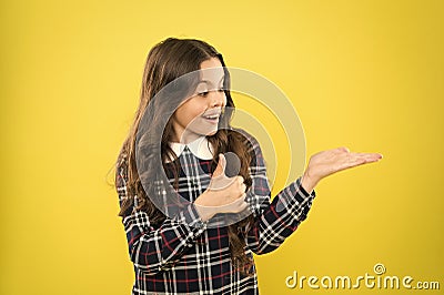 Her hair is perfect. presenting product for hair. Small beauty long curly hair. stylish school uniform for kids. beauty Stock Photo