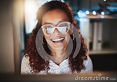 Her positive mindset will push her to meet that deadline. Portrait of a young businesswoman using a computer during a Stock Photo