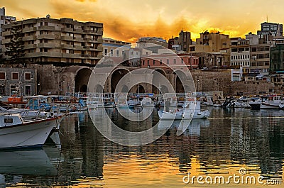 Sunset over the old port with the Venetian shipyards in Heraklion city - Crete Editorial Stock Photo