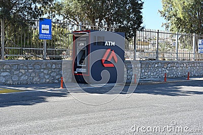 Heraklion, Greece 09 13 2023: Blue ATM machine of Eurobank is standing near bus stop sign. Editorial Stock Photo