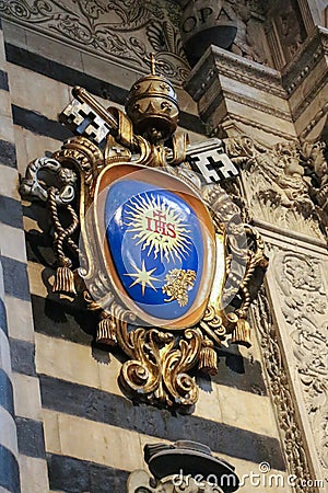 Heraldic coat of arms at the entrance of the Duomo di Siena. Metropolitan Cathedral of Santa Maria Assunta. Italy. Editorial Stock Photo