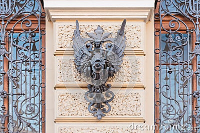 Heraldic symbol forged from iron on an old house in St. Petersburg Stock Photo