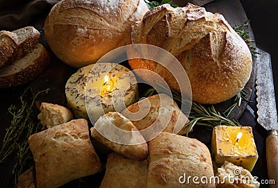 Butter candles with herbs and artisianal breads Stock Photo