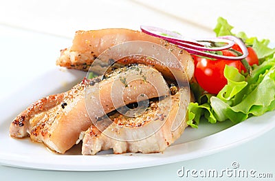 Herb rubbed pork belly slices Stock Photo