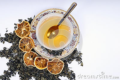 Herbal cup of tea with leaves and lemons Stock Photo
