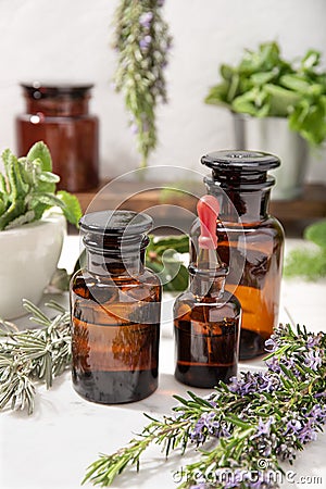 Herbal essential oil on vintage apothecary bottles Stock Photo