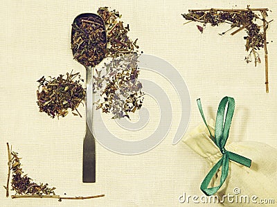 Herbal flat lay of different herbs on linen fabric with a spoon and pouch Stock Photo