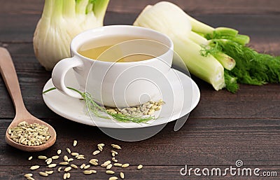 Herbal infusion fennel tea in glass cup or mug with dried fennel seeds and fennel bulbs Stock Photo