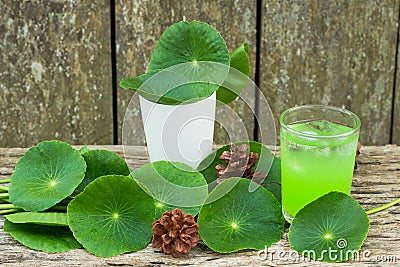 Herbal juice from Centella asiatica,wooden scene,Centella asiatica,Gotu kola Stock Photo