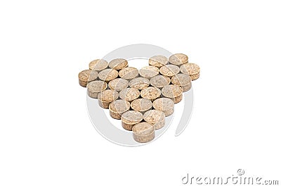Herbal pills form heart shape isolated Stock Photo