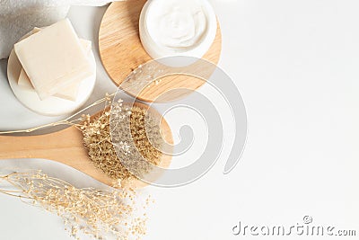 Herbal with soap and bottle with facial cream with wood dish and dried flower and bath brush Stock Photo