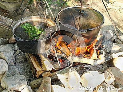 Herbal tea from wild herbs during cooking on open fire Stock Photo