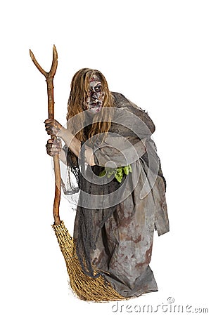 Herbalist or witch with broom Stock Photo