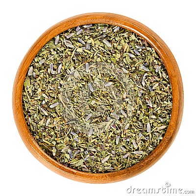 Herbes de Provence in wooden bowl over white Stock Photo