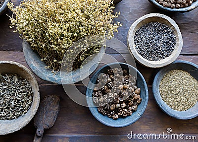 Herbs and spices in bowls Stock Photo