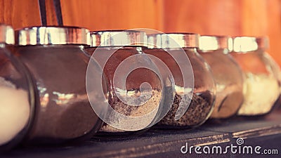 Herbs and spices in glass jars Stock Photo