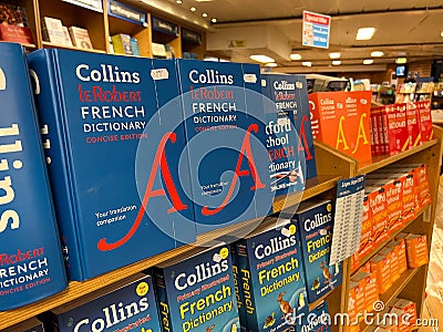 Herceg-Novi, Montenegro - 17 august 2023: Shelves with colorful French dictionaries in a bookstore Editorial Stock Photo