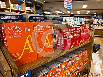 Herceg-Novi, Montenegro - 17 august 2023: Shelves with colorful Spanish dictionaries in a bookstore Editorial Stock Photo