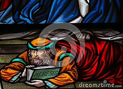 Heretic - Stained Glass in Mechelen Cathedral Stock Photo