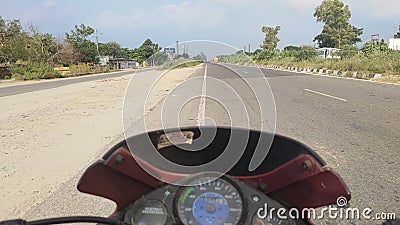 Hero honda glamour motorcycle rider perspective empty road with greenery on both side Stock Photo