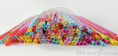 Colorful single-use plastic drinking straws spread on a white background Stock Photo