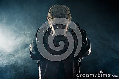 Hero with pistols in hands aiming Stock Photo