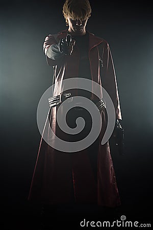 Hero with pistols in hands aiming smoke Stock Photo