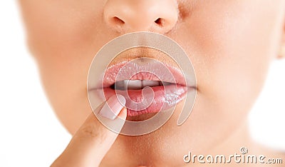 Woman touching her lips with herpes Stock Photo
