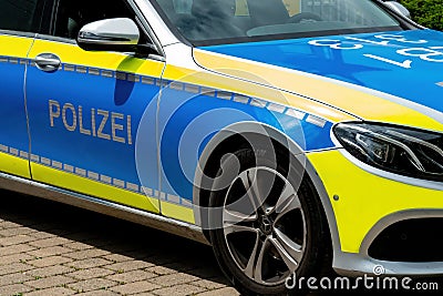 Police crowd control in the cityâ€™s of Germany. Car door lettering: Polizei Editorial Stock Photo