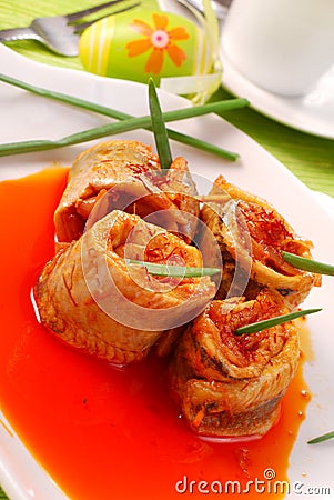 Herring rolls in salsa sauce for easter Stock Photo