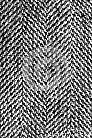 Herringbone tweed wool fabric texture background closeup. Natural organic wool cloth with classic pattern Stock Photo